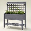 Gray mobile wooden planter with trellis, shelves, and caster wheels